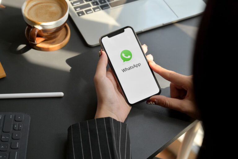 woman-holding-smartphone-with-whatsapp-app